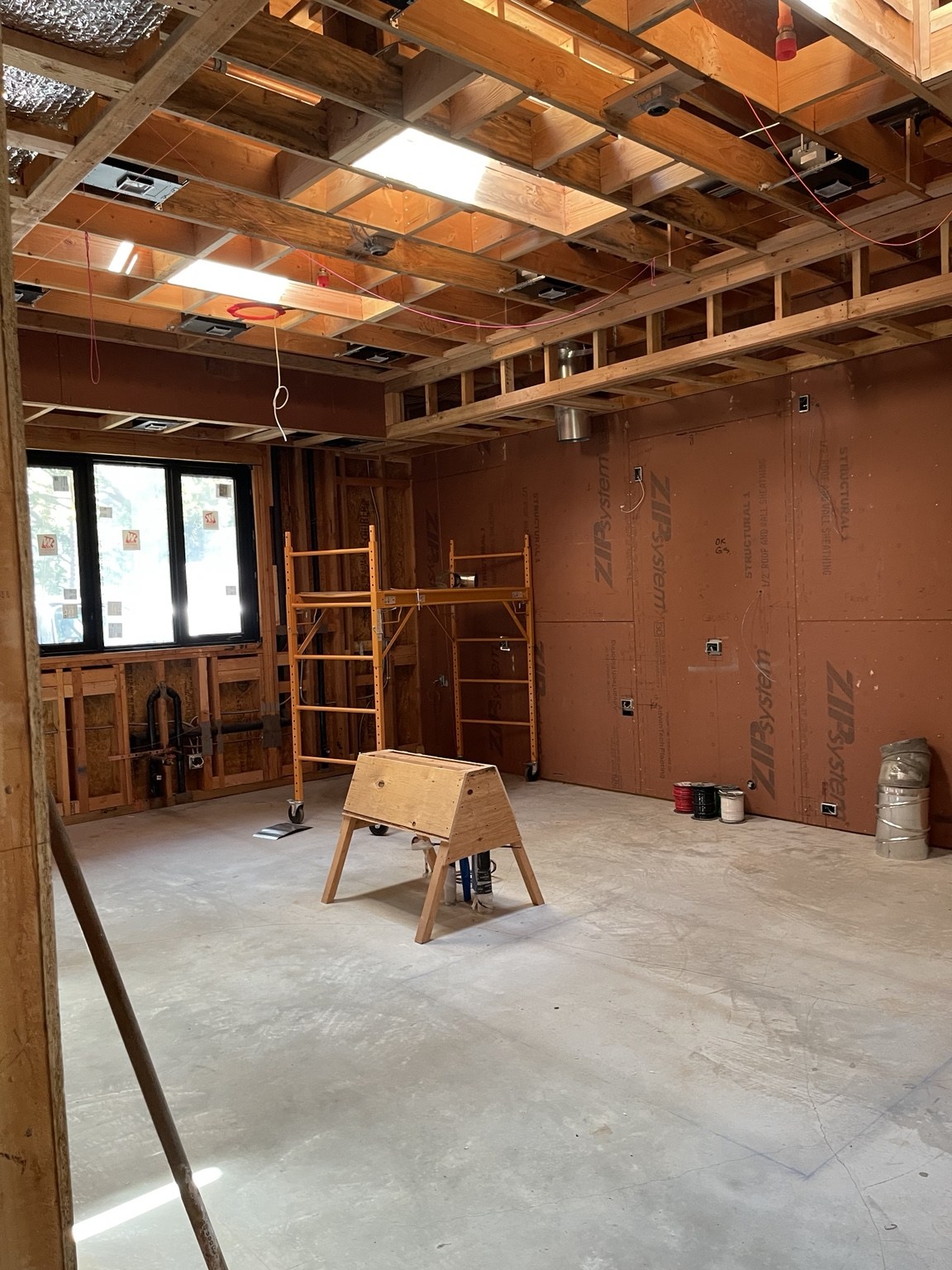 Ceiling framing, skylights, and building services in progress