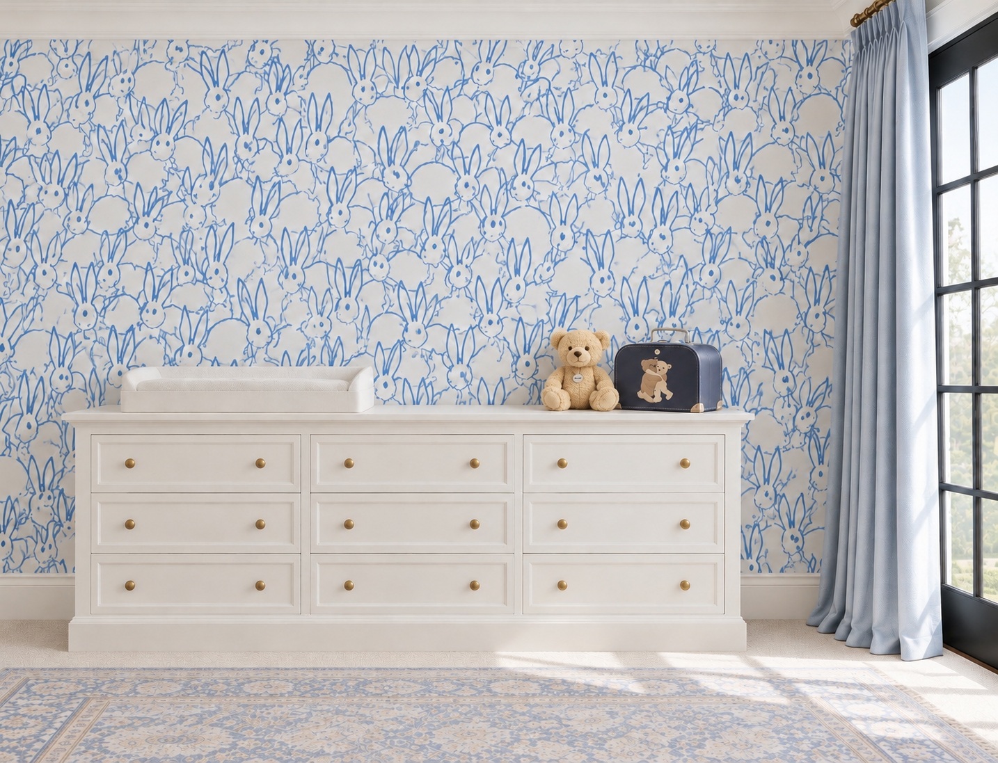 Bedroom dresser against blue patterned wallpaper