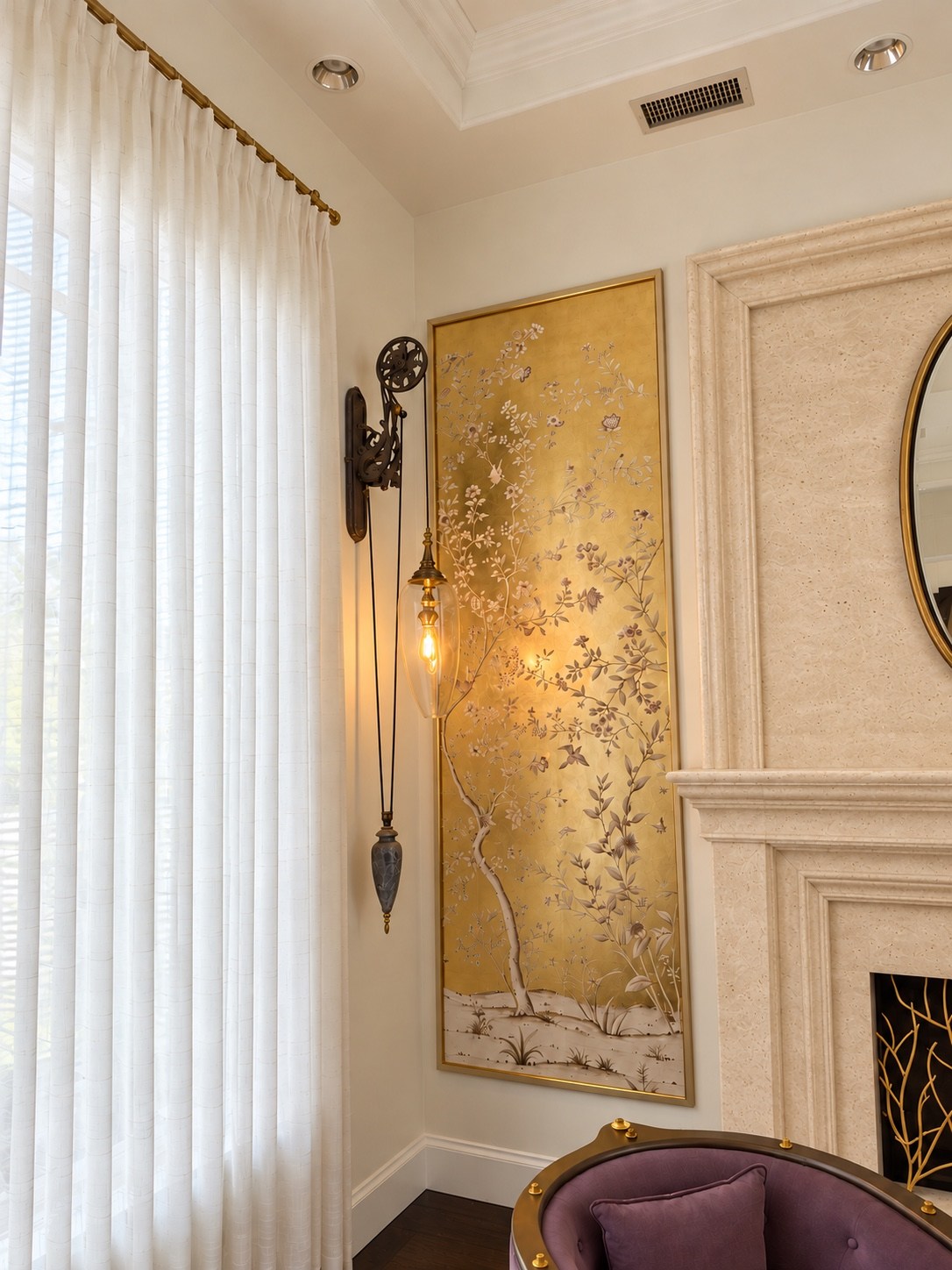 Living room gold wall panel and soft sheer drapery