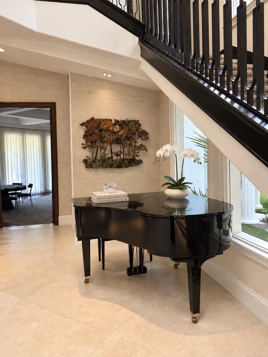 Grand piano beneath the staircase