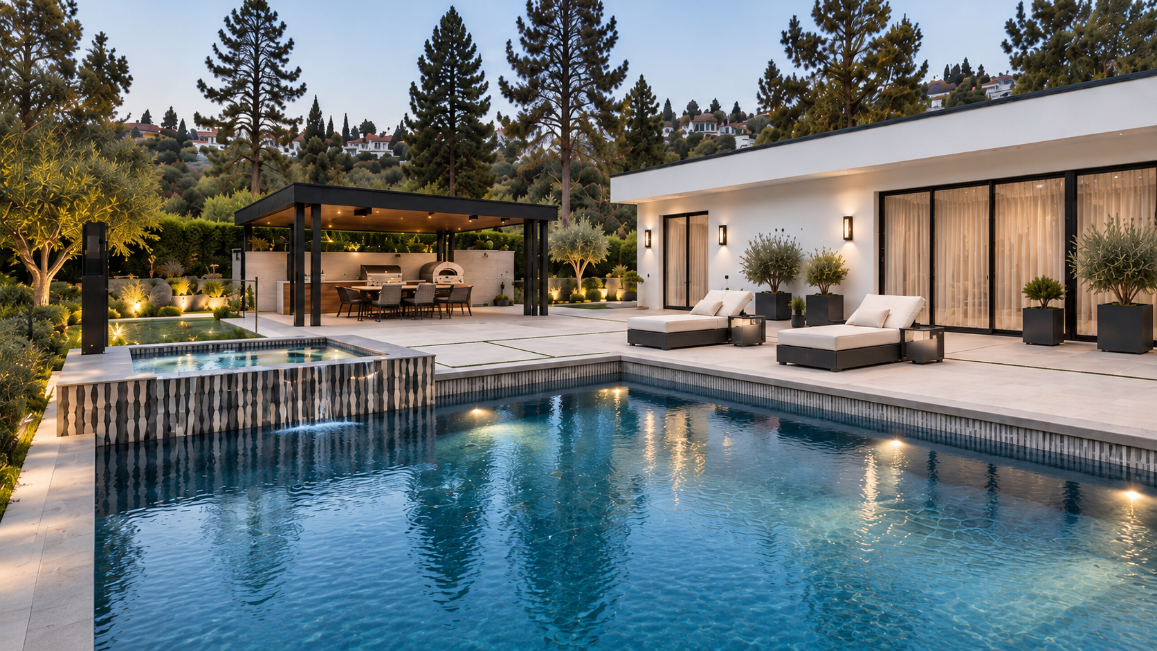 Pool and spa with covered outdoor kitchen and sun loungers