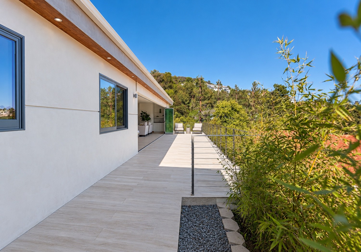 Side terrace with planting and hillside views