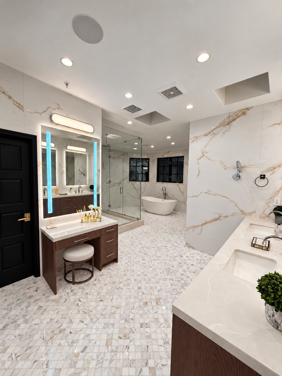 Bathroom with makeup vanity, glass shower and freestanding tub