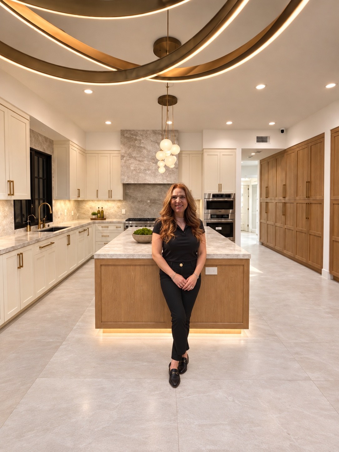 Kitchen island beneath sculptural lighting